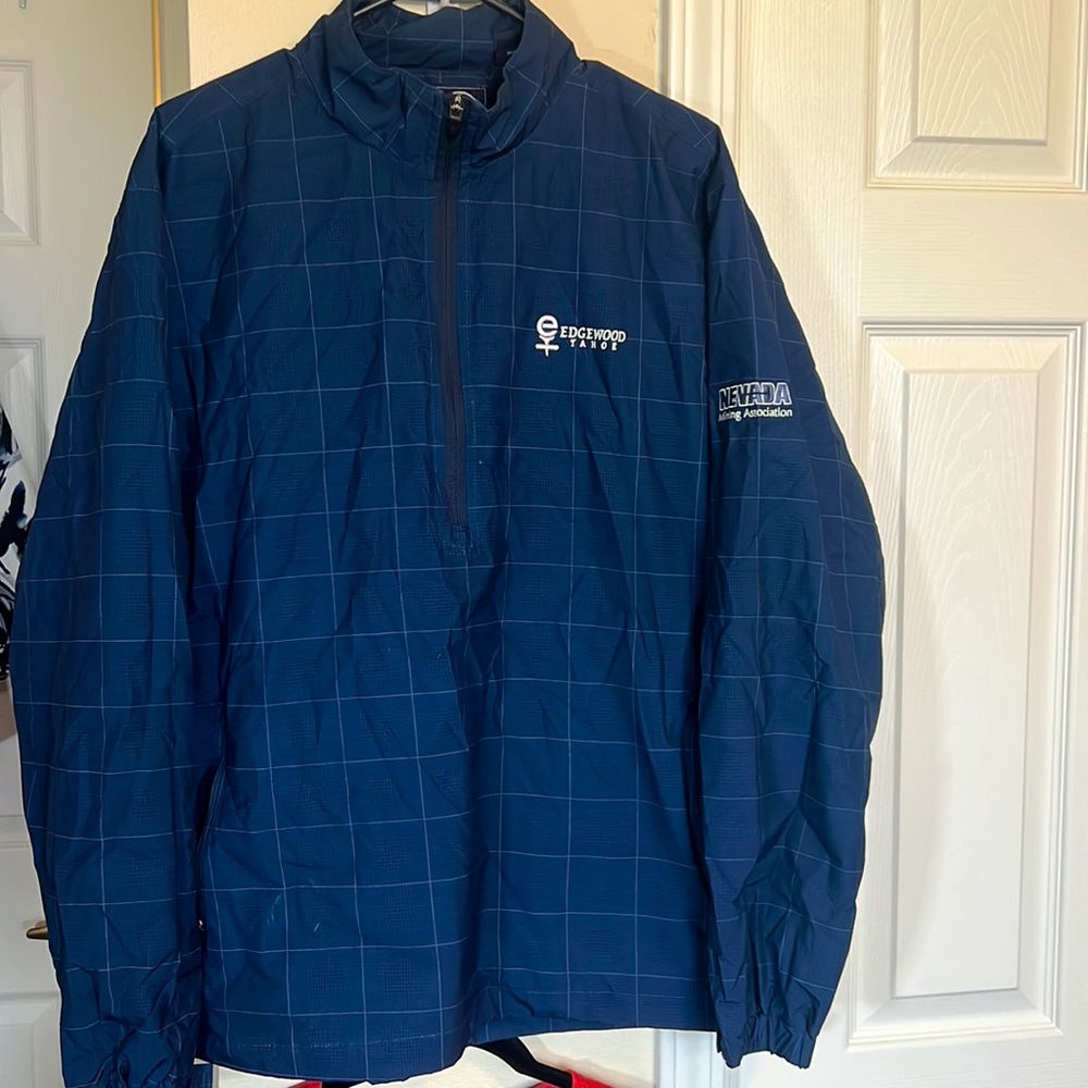 Navy blue polyester performance, half zip pull over jacket